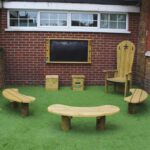 Opus Post-Mounted Bench On Grass Around Story Teller's Chair