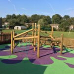 Play equipment on wet pour rubber surfacing