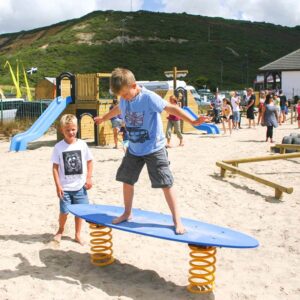 Child surfing on the spring surfboard