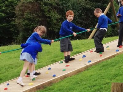 Children Playing On Rock Ramp Climber