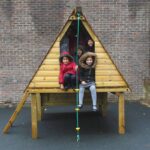 Children Playing On Jungle Play Den In Play Ground