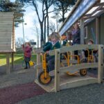 Children Playing On Timber Baby Bridge
