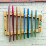 The wall mounted chimes mounted on a white wall