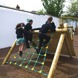 Children on scramble net rock wall climber