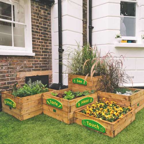 planter stax outside a white building