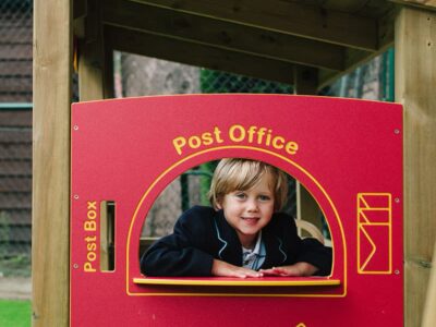 Boy Playing In Playtime Shop Post Office
