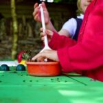 Children Playing In Mud Kitchen Close Up