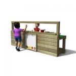 Children Playing In Mud Kitchen With White Board