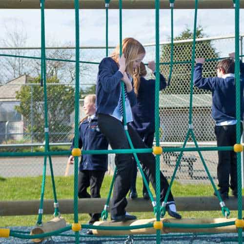Children Playing On Climbing Ship Log Crossing