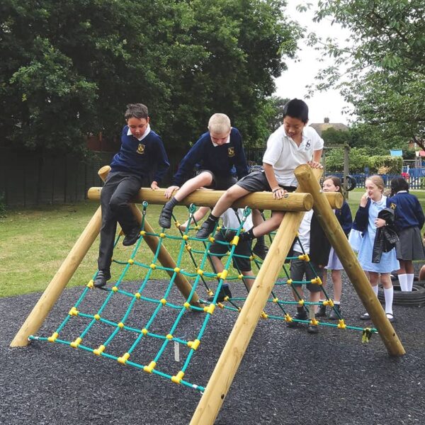 Children on cargo net climber in school playground