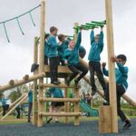 School children playing on treetops three