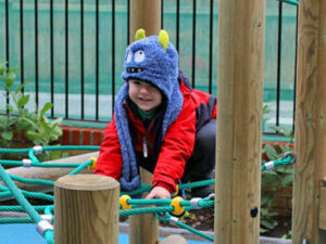 Child playing on EYFS Portable Playground Equipment