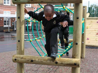 Child climbing through the rope tunnel