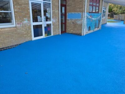 Blue wet pour safety surfacing