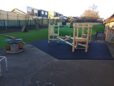 Climbing frame and safety surfacing