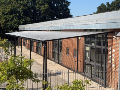 steel lean-to canopy attached to a school building